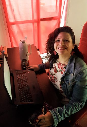 Andrea Collados, teaching at her home office.