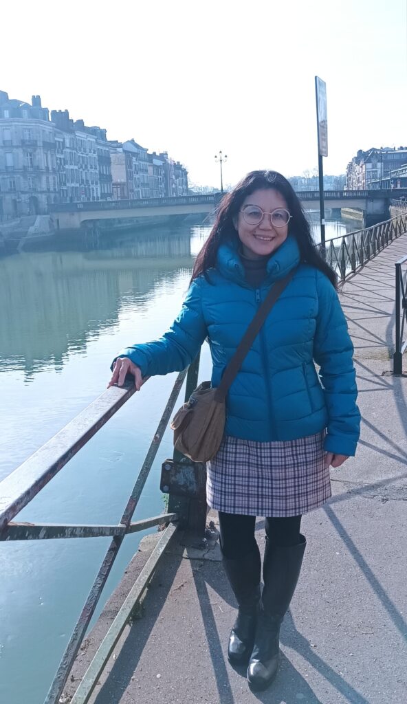 Belinda posing by the river in Bayonne, France.