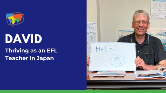 David Leach holding a whiteboard that says, "Hello."