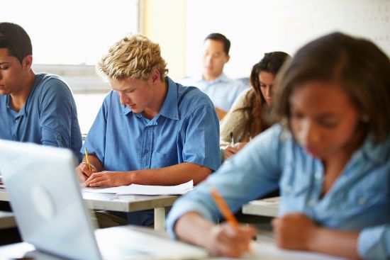 adult students completing a test.