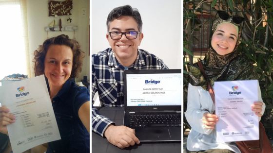 Three teachers, a woman, a man, and another woman, hold up their Bridge TEFL certificates.