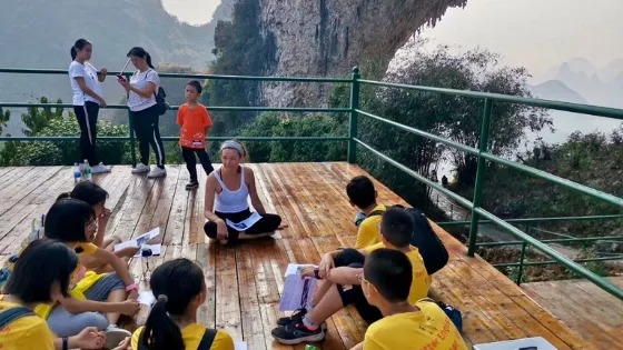 An ESL teacher works with students abroad