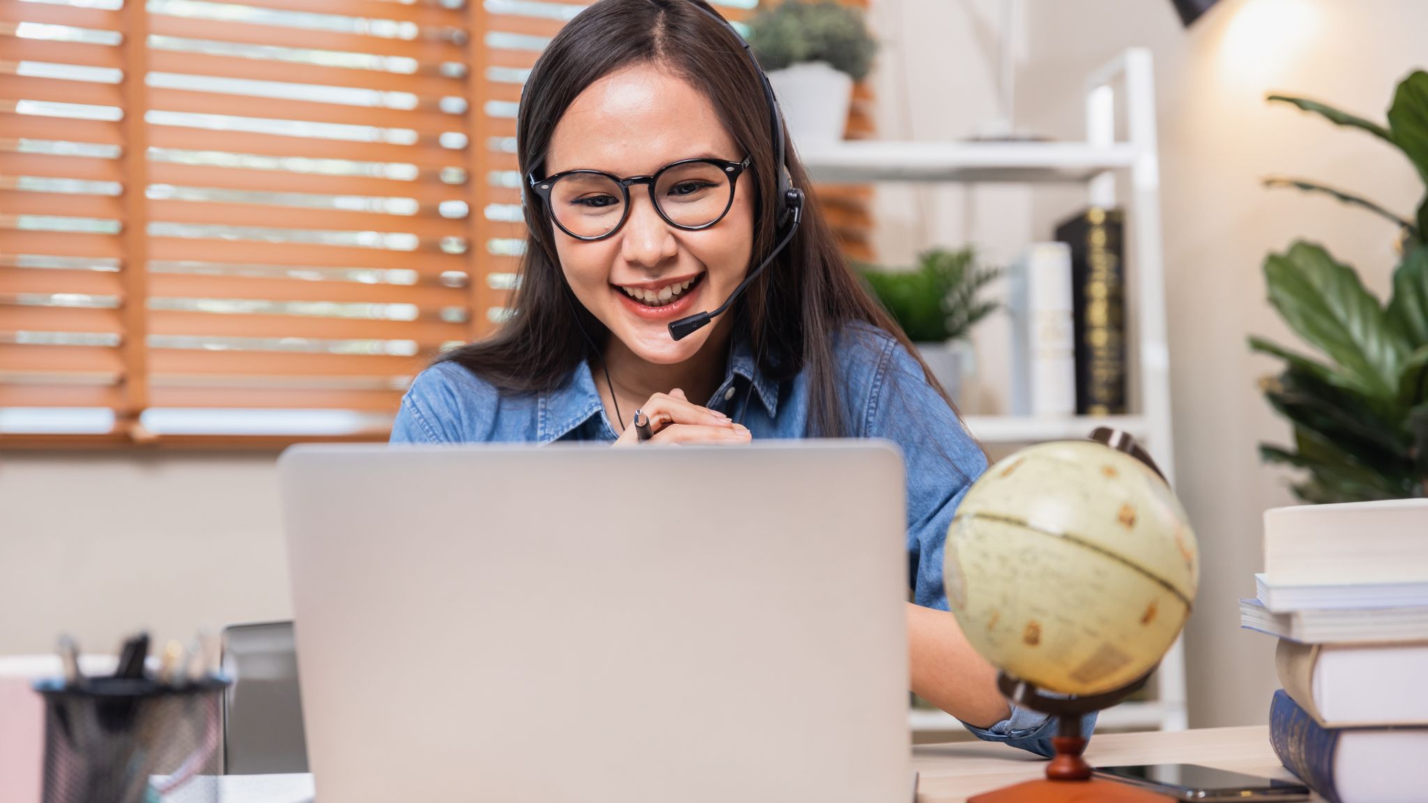 an online teacher smiling at her students