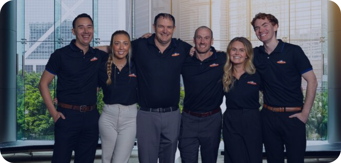 Group of teachers in an office smiling 