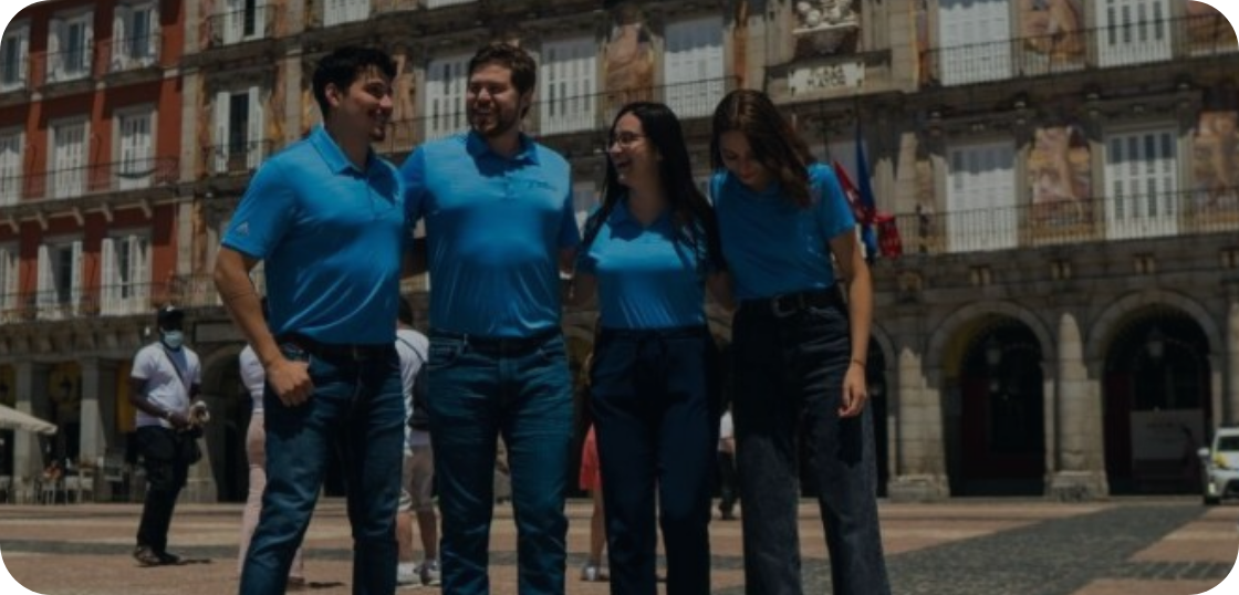 Group of teachers in an office smiling 